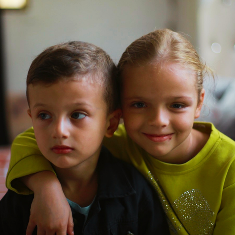UNRWA Gaza orphan support campaign: two children together, highlighting support for separated and orphaned Palestine Refugee children